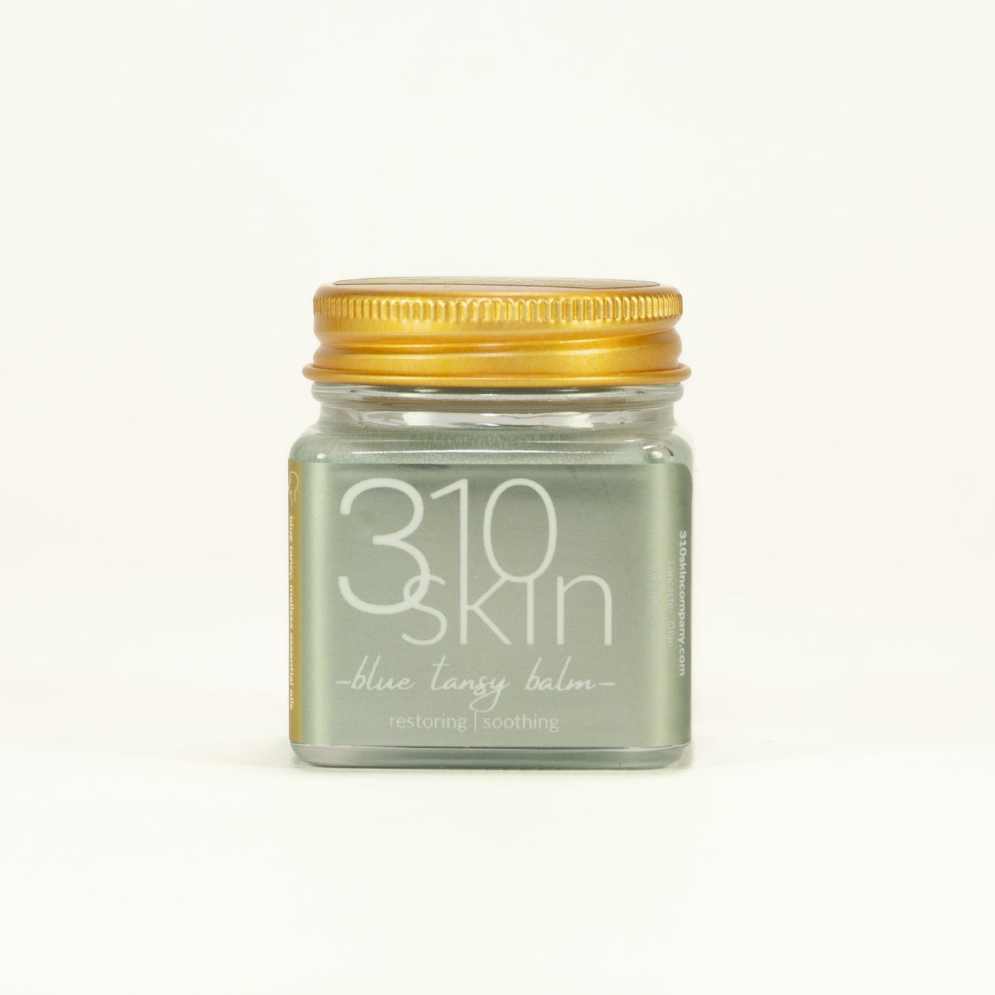 Jar of 310 Skin blue tansy balm on a white background