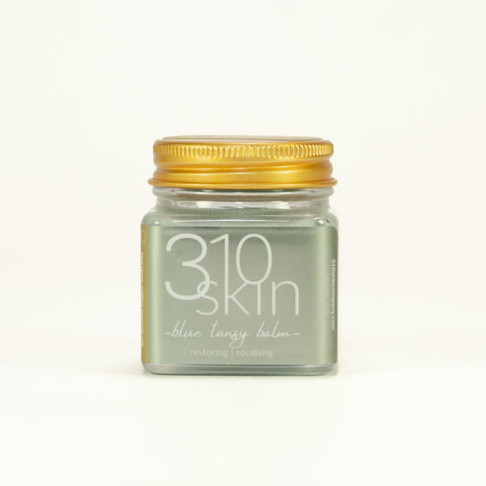 Jar of 310 Skin blue tansy balm on a white background